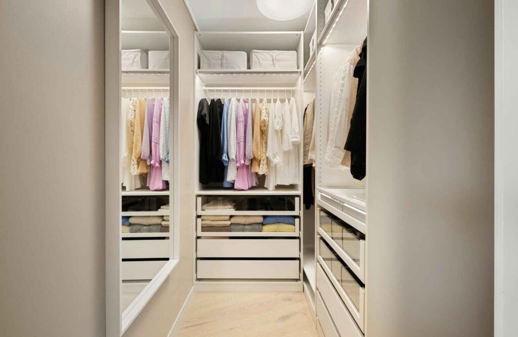 you-organized-by-barb-westchase-fl-benefits-of-professional-home-organizer-womans-closet-organized-neatly-well-lit-simplify