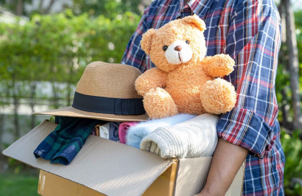 you-organized-by-barb-tampa-fl-letting-go-with-intention-donation-box-with-teddy-bear-hat-and-clothing-simplify-whole-home-organization