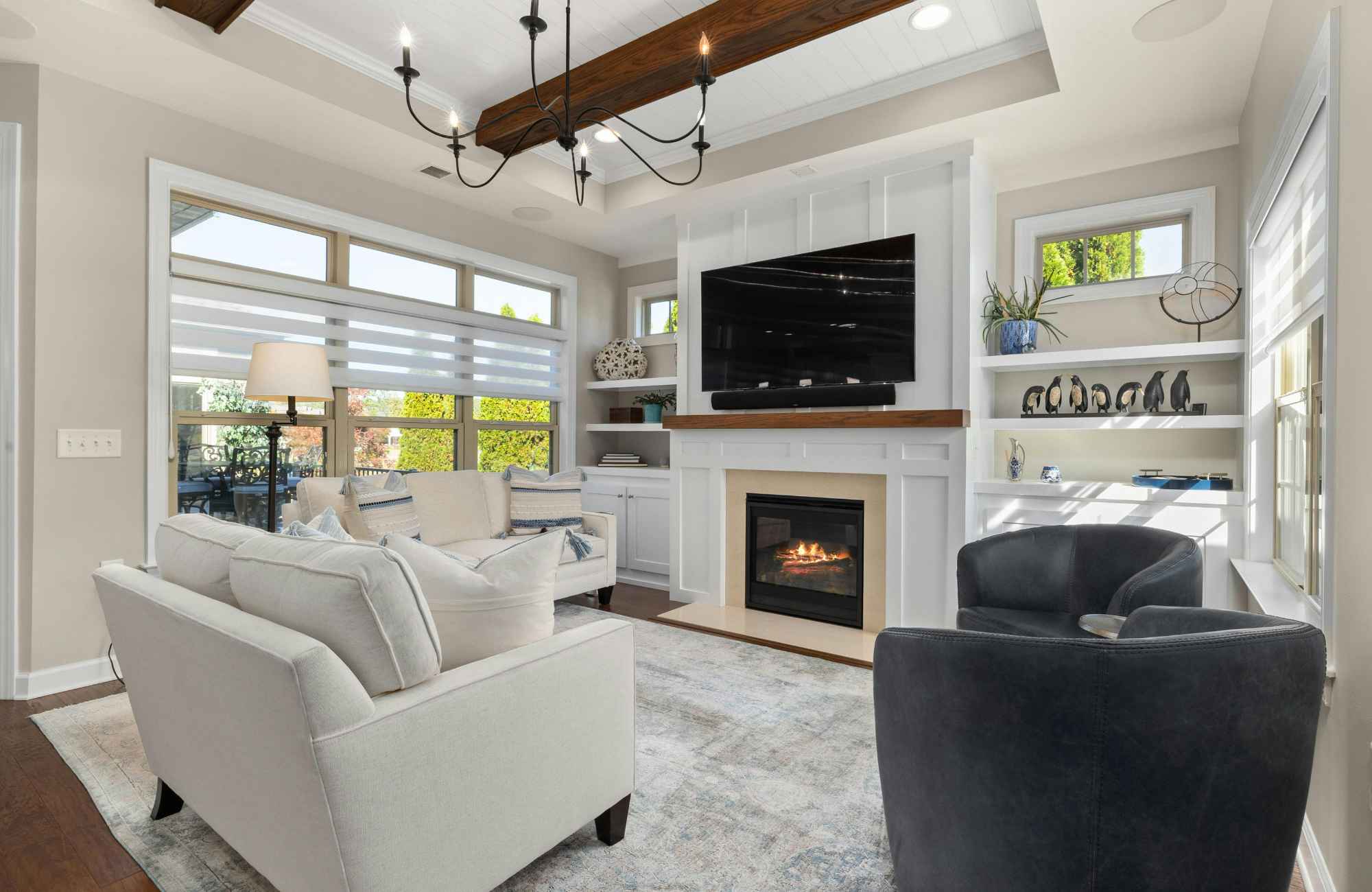 professional-home-organizer-clearwater-fl-time-to-hire-organizer-living-room-high-ceilings-ceiling-beams-built-in-cabinets-around-fireplace-calm