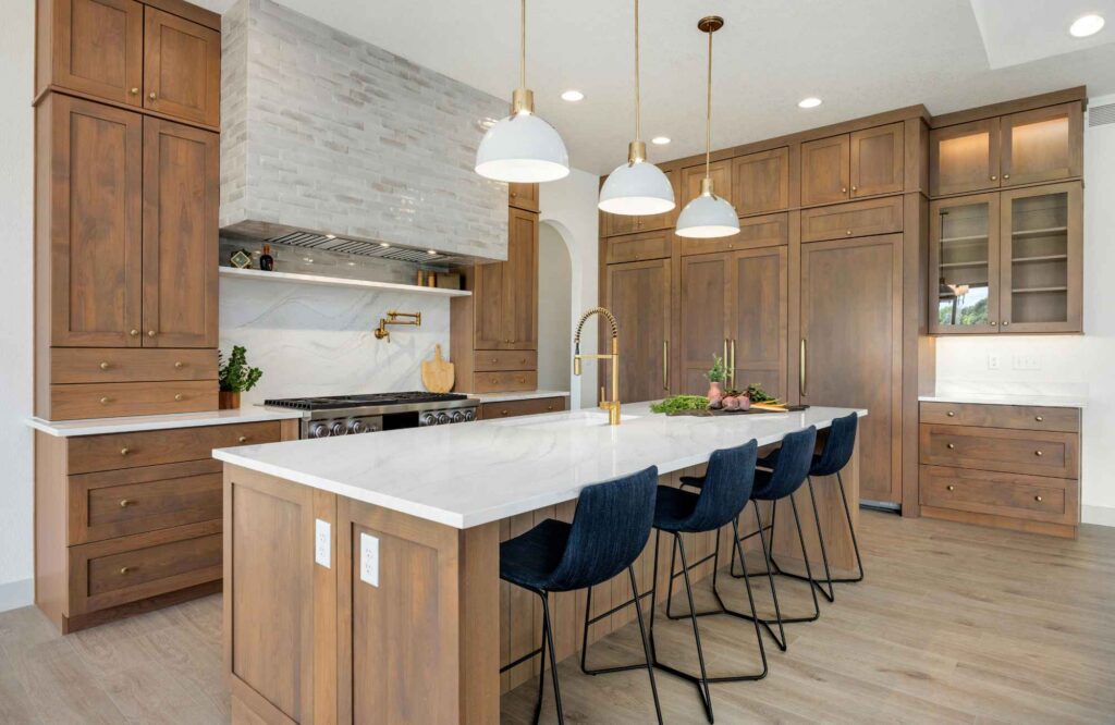 you-organized-by-barb-tampa-bay-fl-time-to-hire-organizer-luxury-kitchen-stained-wood-cabinets-large-island-white-countertops-custom-range-hood
