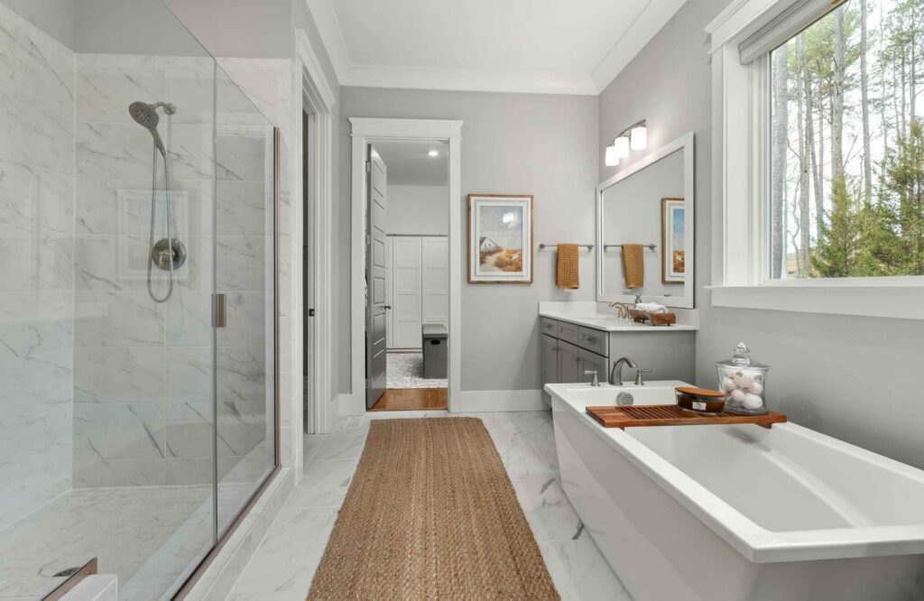 you-organized-by-barb-westchase-fl-time-to-hire-organizer-luxury-bathroom-white-and-gray-soothing-soaking-tub-glass-shower-simplify